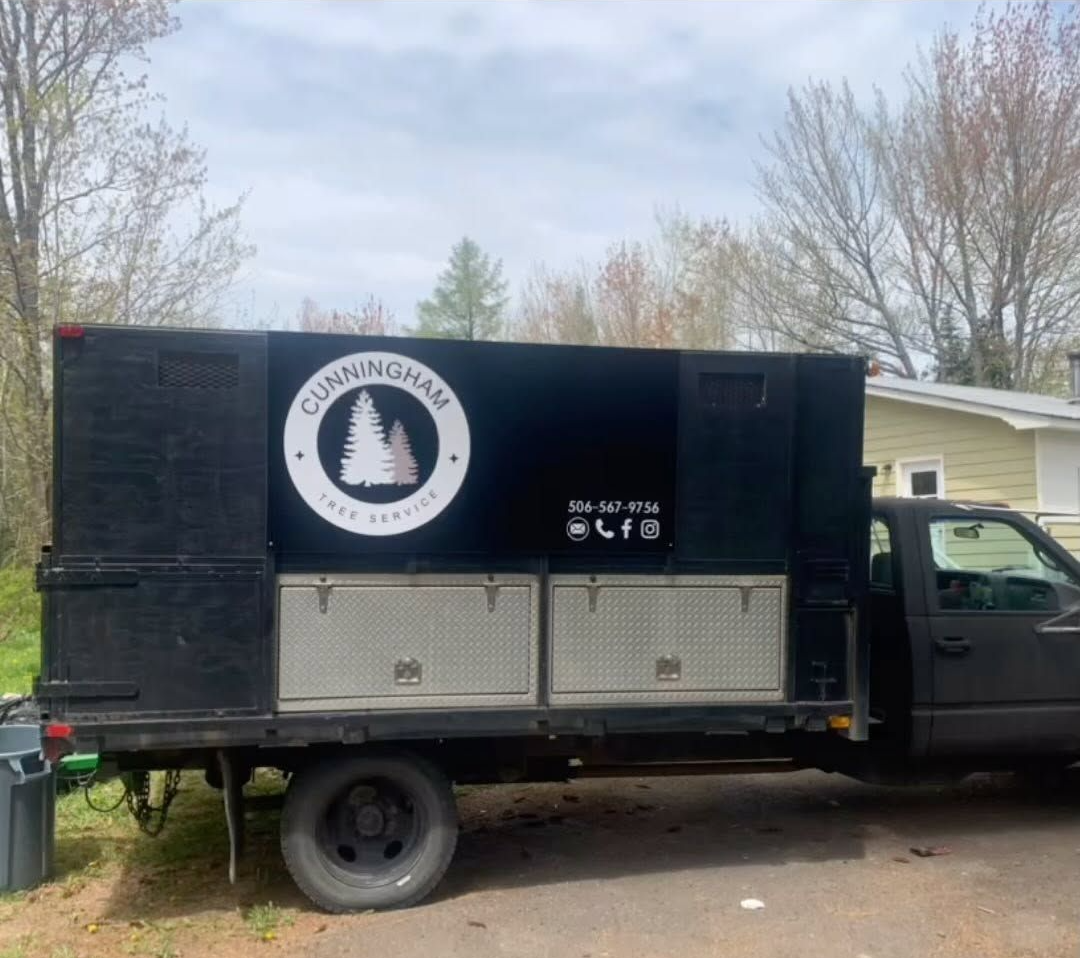 Cunningham Tree Services dump trailer with the company badge